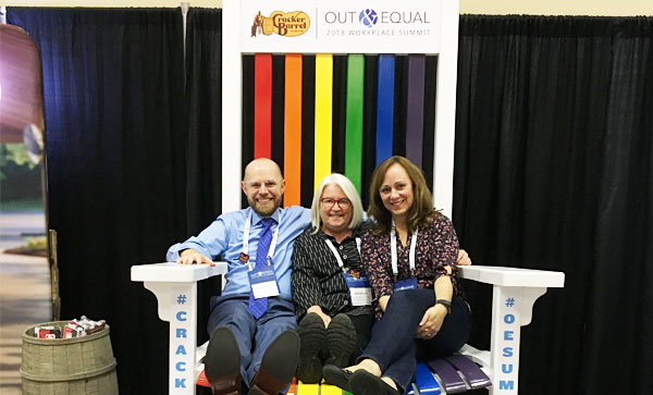 Iron Mountain Presents at the Out & Equal Conference- Three people sitting on a chair