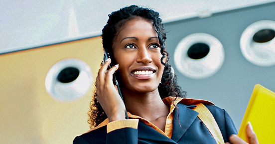 A young and happy female talking on the phone