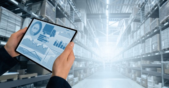 4 Digitization Best Practices to Follow Now and After the COVID-19 Pandemic- A person checking warehouse data in his tablet