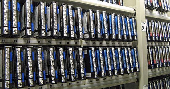 Backup vs. Archive: Know the Difference - Shelf with tapes