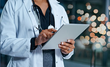  Is a Web-Based EMR in Your Future? - A doctor looking at web based medical records
