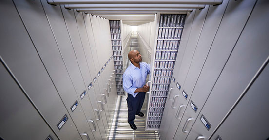 Less Is More: Risk Management and Your Backup Plan - Employee Opening Tape Rack