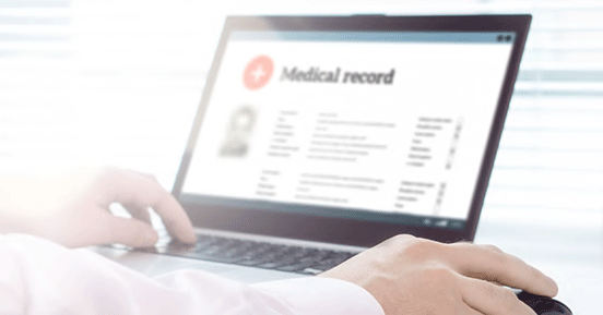 Using Information Governance to Improve Efficiency, Reporting, and Patient Outcomes - Medical record on laptop