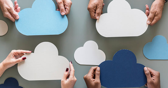 Is the Cloud the best solution for storing all your data- People holding tiny cloud shaped cards