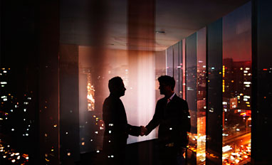 Privacy Is Paramount in a Digital Workplace- Businessmen shaking hands